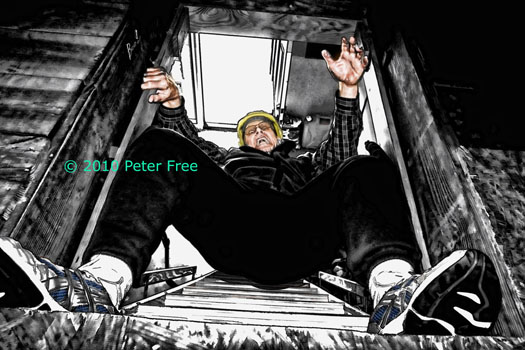 Picture of Pete (aka Peter) Free falling out of an attic door in the ceiling.